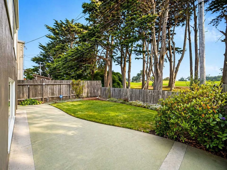 Private backyard with open space and patio - perfect for relaxing outdoors or enjoying fresh air.