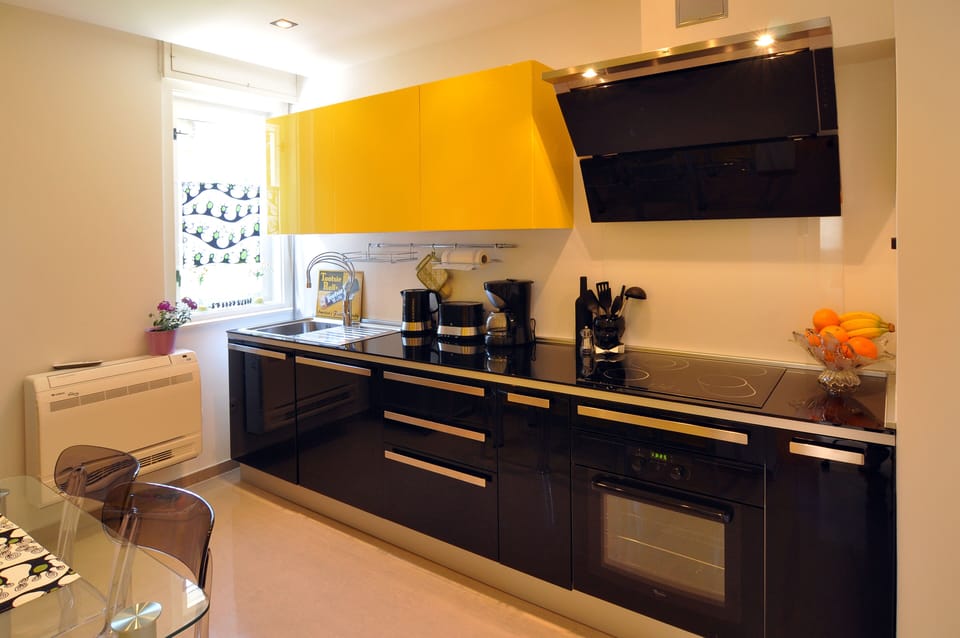 ...fully equipped kitchen with tempered glass shelf