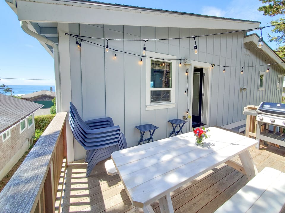 Back deck with ocean view, picnic table and propane grill