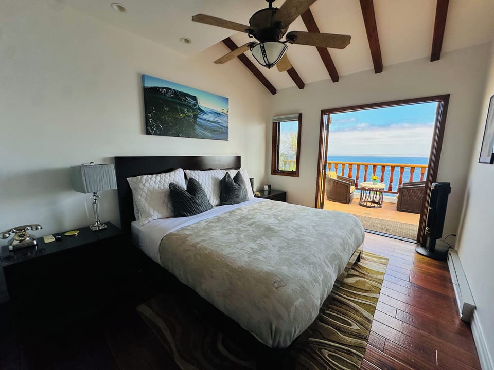 - Drift off to the sound of the surf and wake to the glow of ocean sunrise at your doorstep
- Vaulted beams, crisp linens, & soft coastal light create the ultimate seaside sanctuary
- Open the doors & greet the morning with a deep breath of salty air