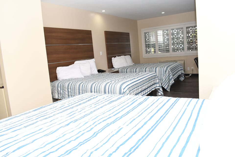 Room, Multiple Beds, Non Smoking | Iron/ironing board, rollaway beds, free WiFi, bed sheets