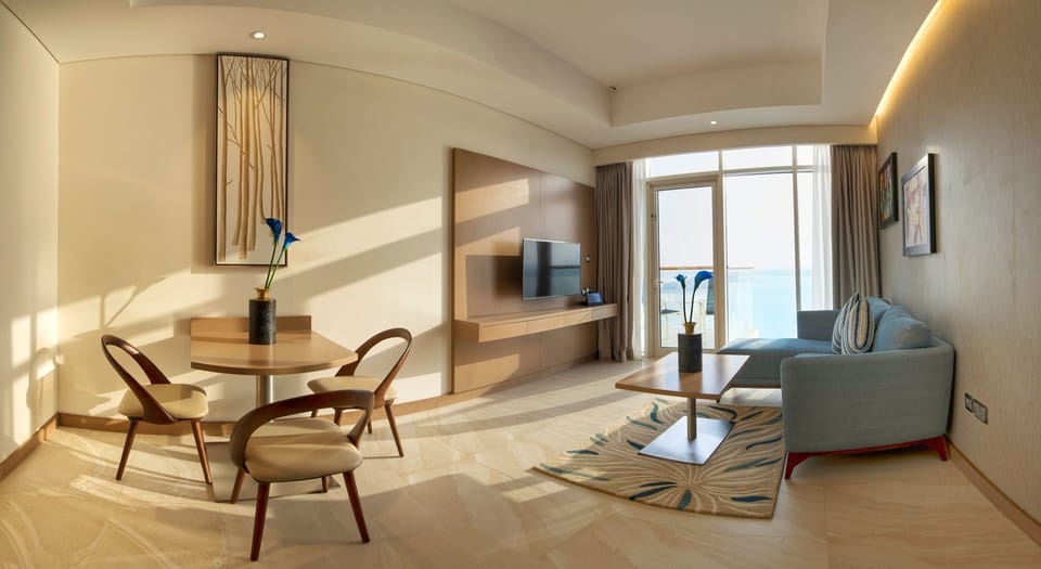 One-Bedroom Suite with Sea View and Hotel Private Beach Access | Living area | Flat-screen TV, toys
