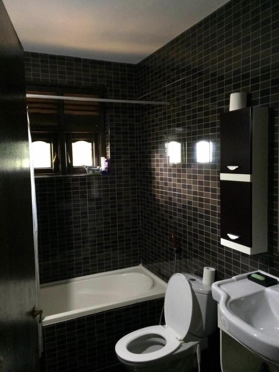Separate tub and shower, rainfall showerhead, free toiletries