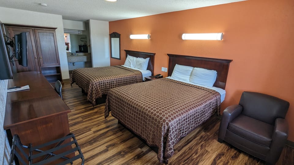 Deluxe Room, 2 Queen Beds | Desk, WiFi (free), bed sheets