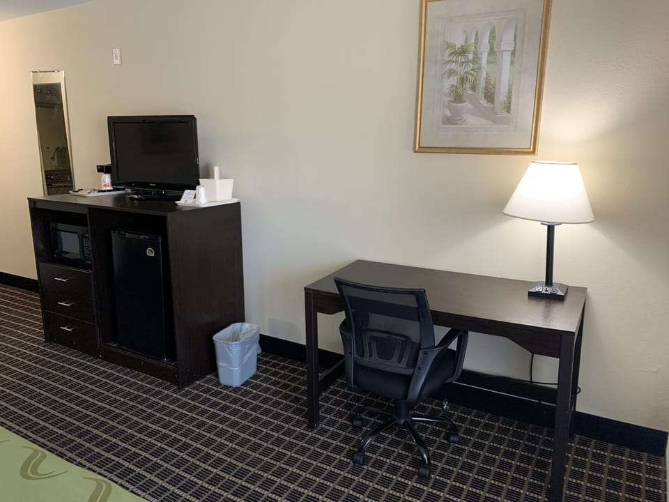 Desk, blackout drapes, iron/ironing board, free cribs/infant beds
