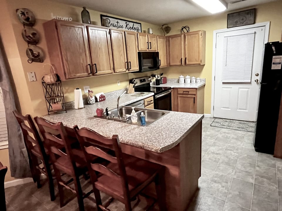 The kitchen has a microwave, dishwasher, refrigerator, blender, CrockPot & more!