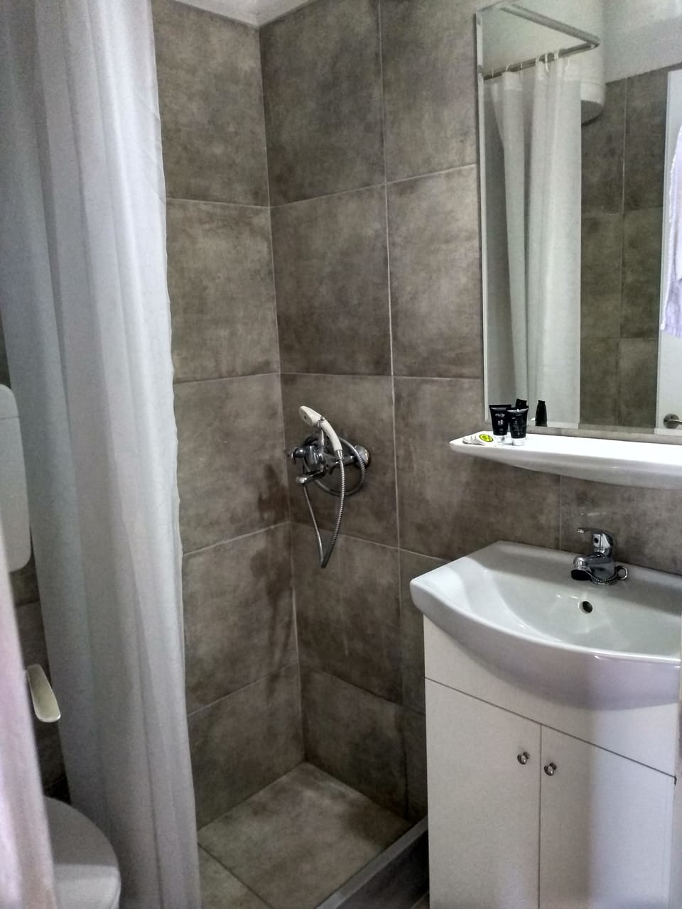 Shower, free toiletries, hair dryer, slippers