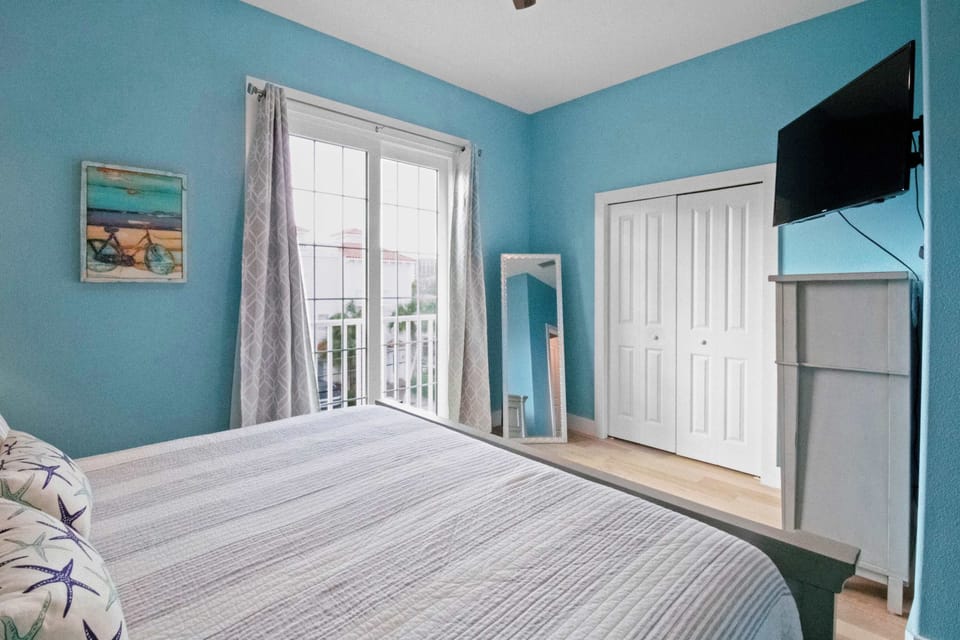 Upper level bedroom with Juliet balcony. 
