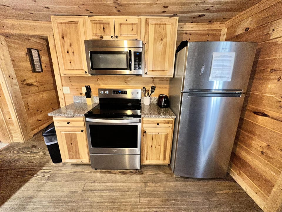 Cozy cabin kitchen with modern stainless steel appliances