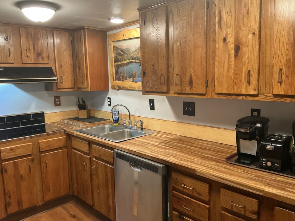 Kitchen,just newly remodeled, with teak countertops, new induction stove.