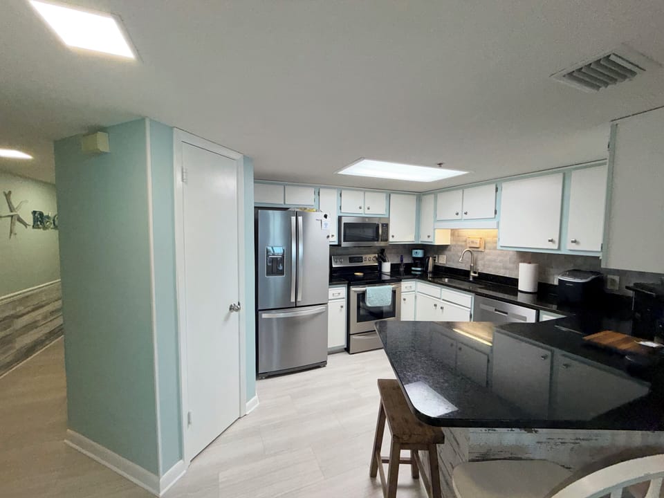 Open kitchen with beautiful stainless appliances