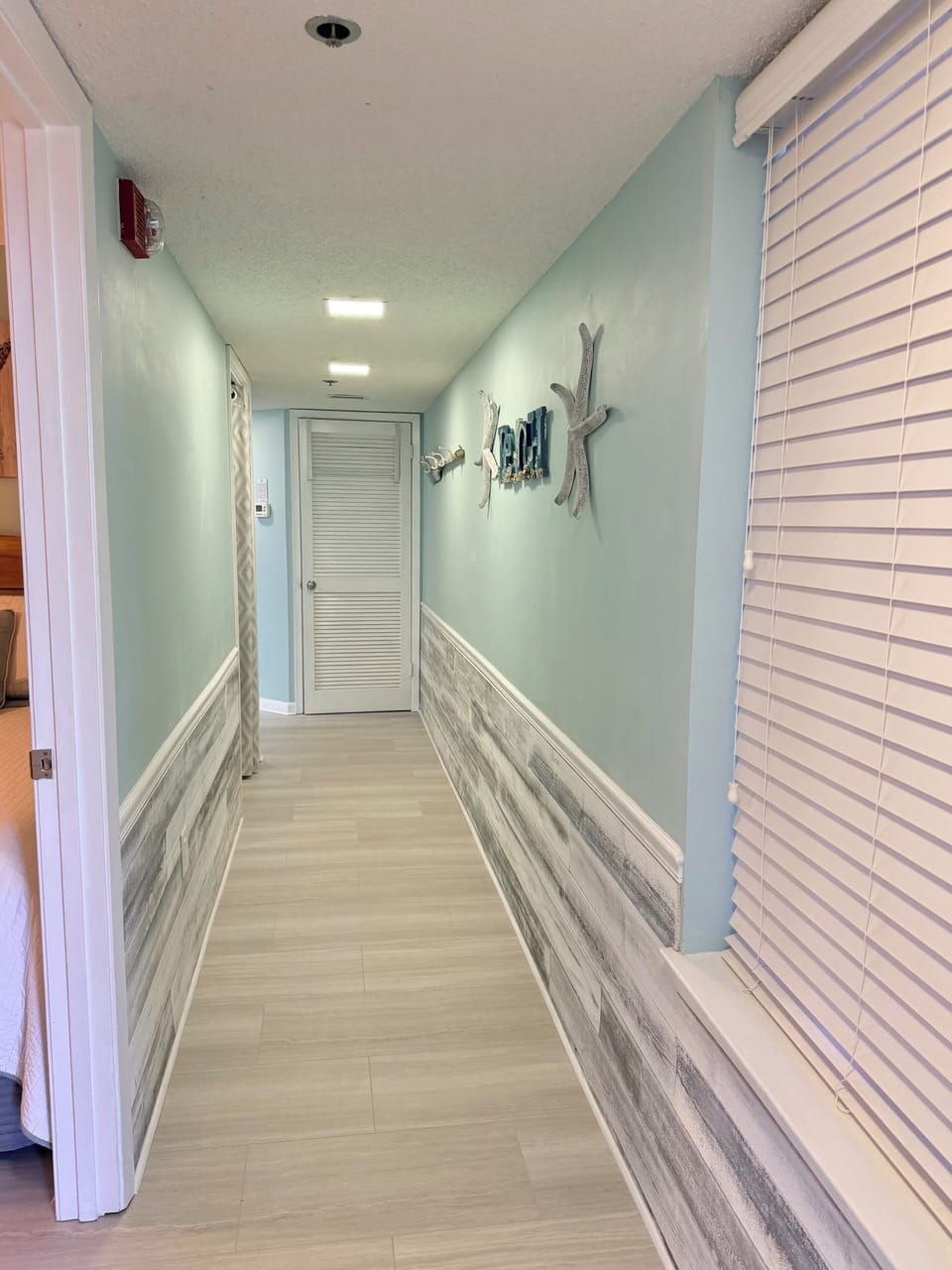 New flooring in entry hall leading to kitchen