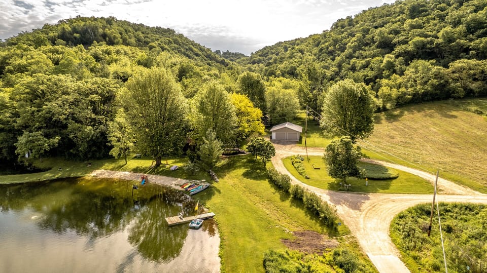Pond, driveway and parking lot area. 