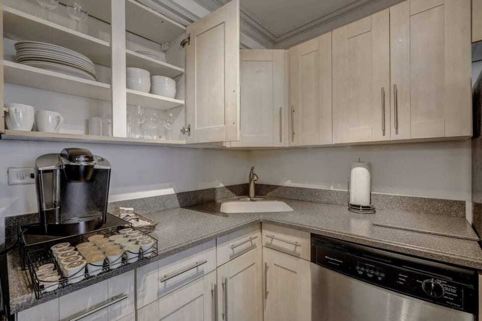 Well-equipped kitchen corner w/ coffee maker & plenty of cabinet storage
