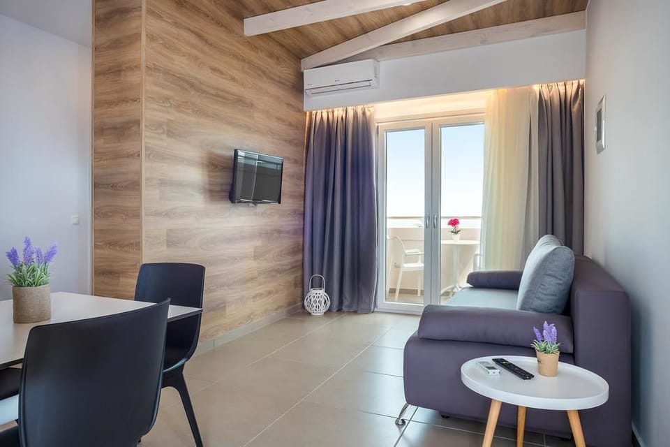 Suite, Hot Tub, Sea View | Living area | Flat-screen TV