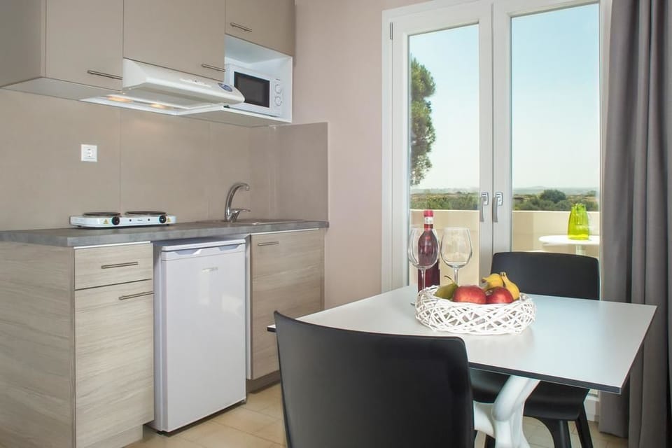 Apartment, 1 Bedroom | Private kitchen | Fridge, microwave, stovetop, electric kettle