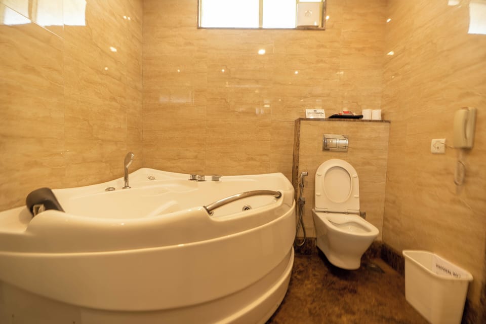 Suite | Bathroom | Bathtub, hair dryer, slippers, bidet
