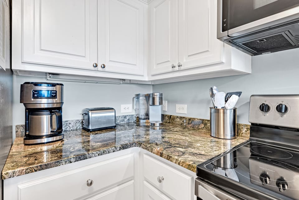 Kitchen with granite counter tops.