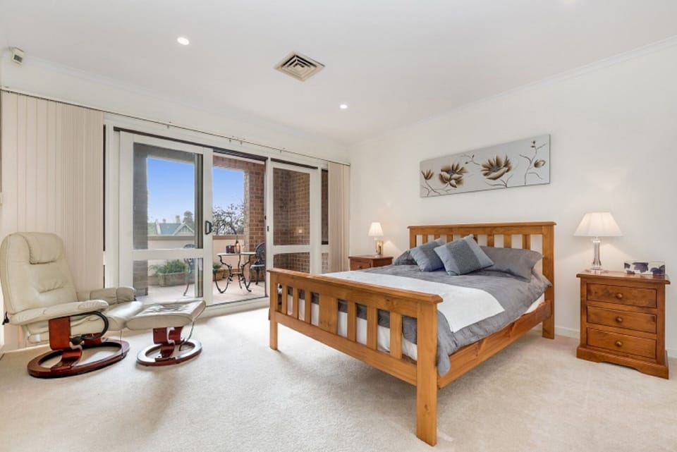 Enjoy a wonderful nights sleep in this spacious main bedroom and private balcony