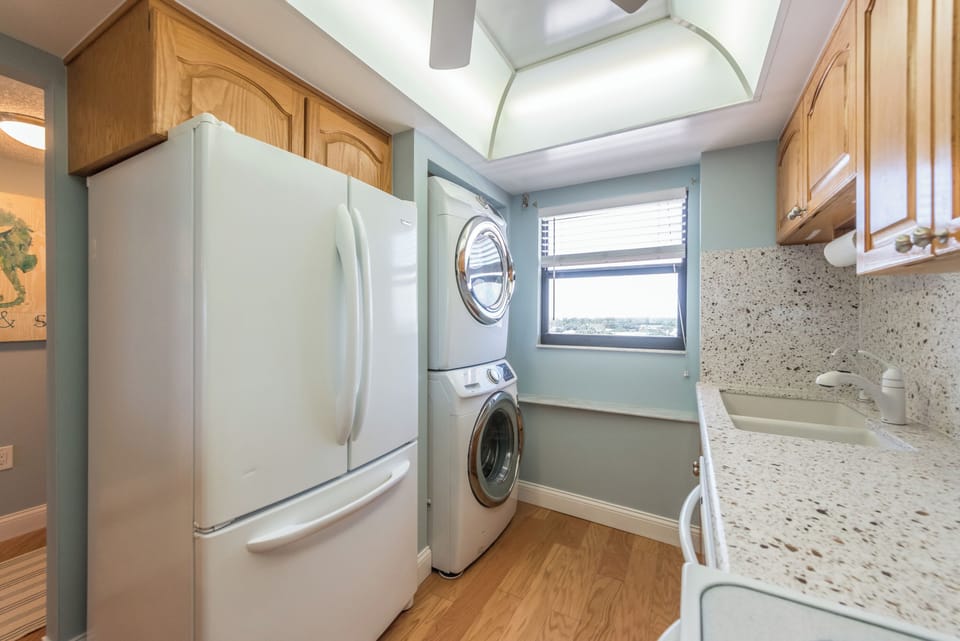Fully equipped kitchen with modern appliances and in-unit laundry.
