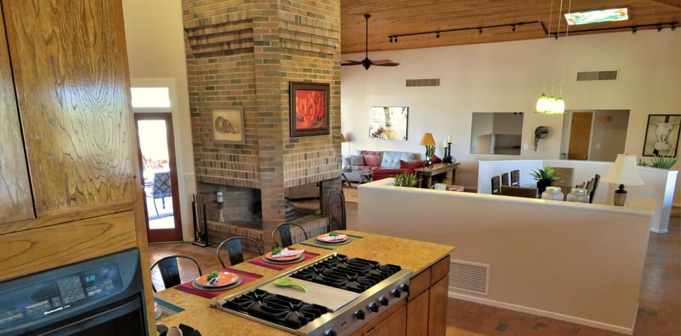 Wide open spaces with a fireplace focal point.