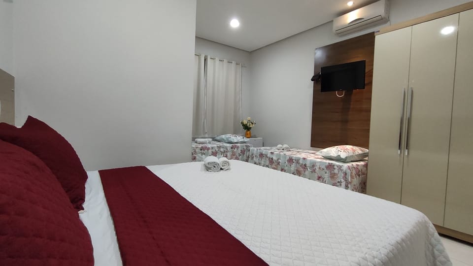 Triple Room | Minibar, desk, blackout drapes, free WiFi