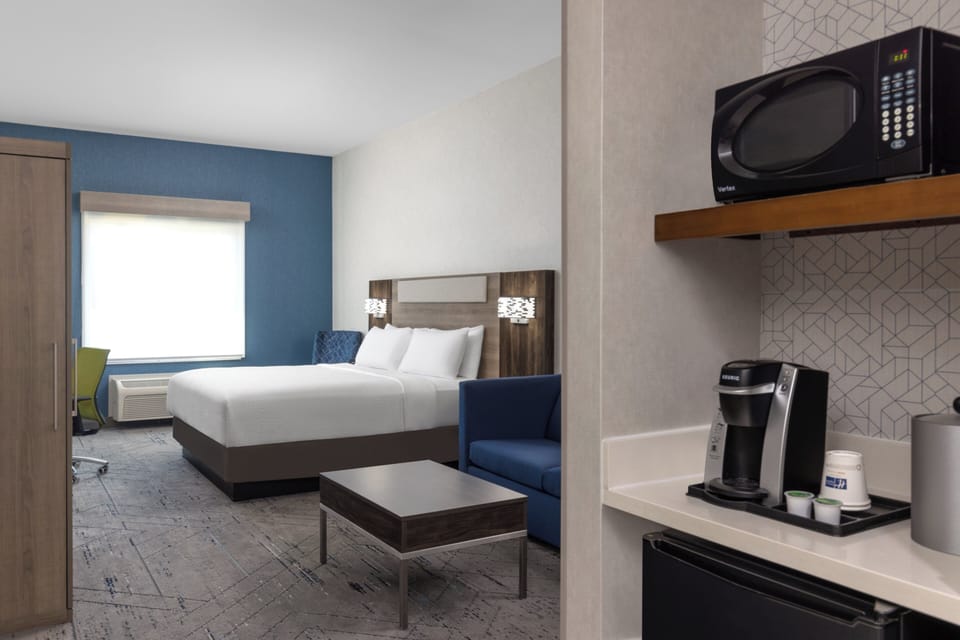 Suite, 1 King Bed (Additional Living Area) | Blackout drapes, iron/ironing board, cribs/infant beds, rollaway beds