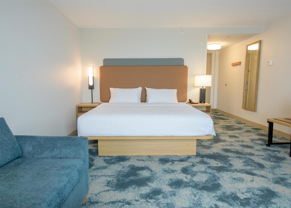 Room, 1 King Bed with Sofa bed, Non Smoking, Refrigerator & Microwave | Living area | 32-inch LCD TV with cable channels, TV
