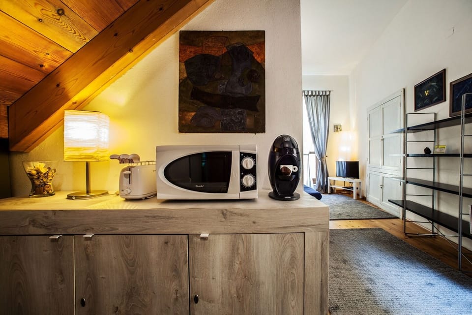 Deluxe Studio | Living area | Flat-screen TV