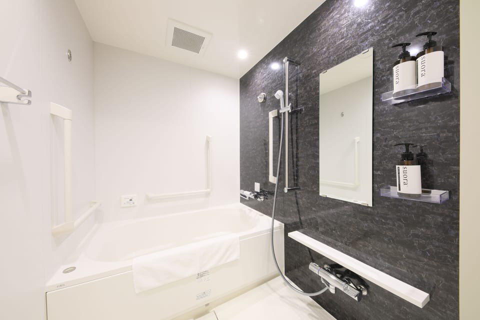 Combined shower/tub, free toiletries, bathrobes, slippers