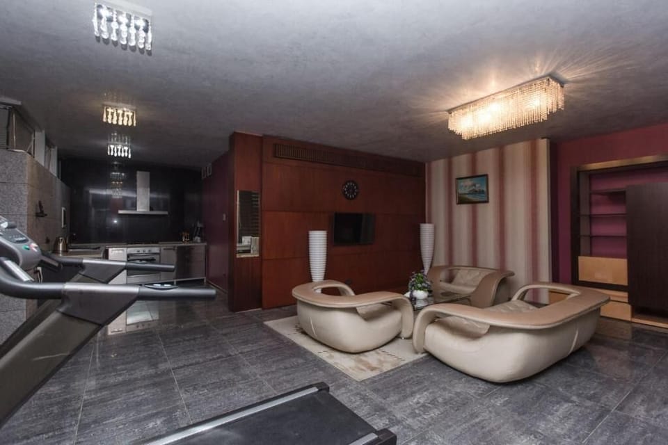 Luxury Apartment, Multiple Beds | Living room | Flat-screen TV, DVD player, streaming services
