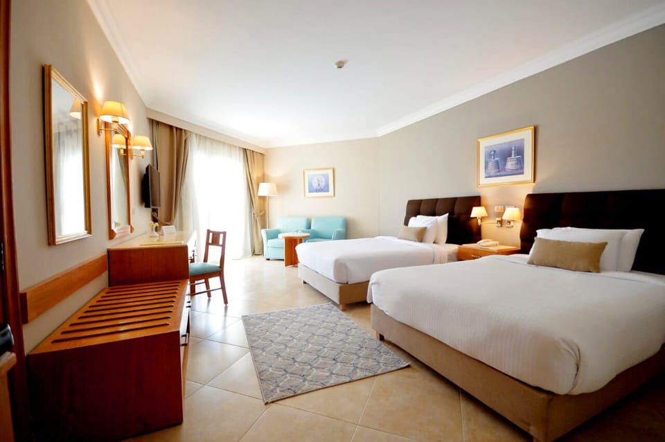 Deluxe Room, Pool View | Egyptian cotton sheets, in-room safe, desk, laptop workspace