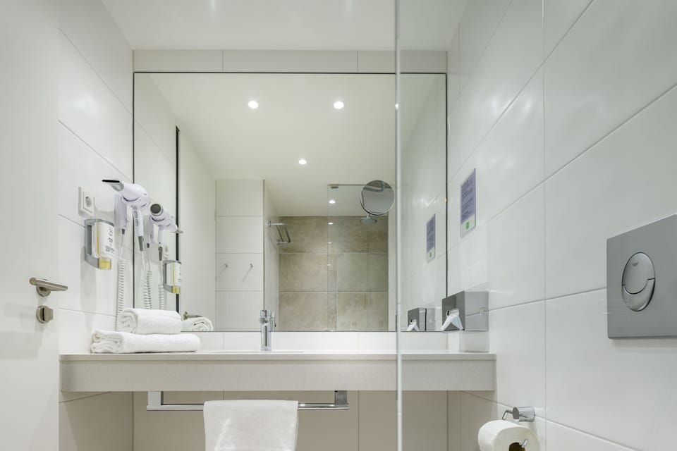 Shower, eco-friendly toiletries, hair dryer, towels