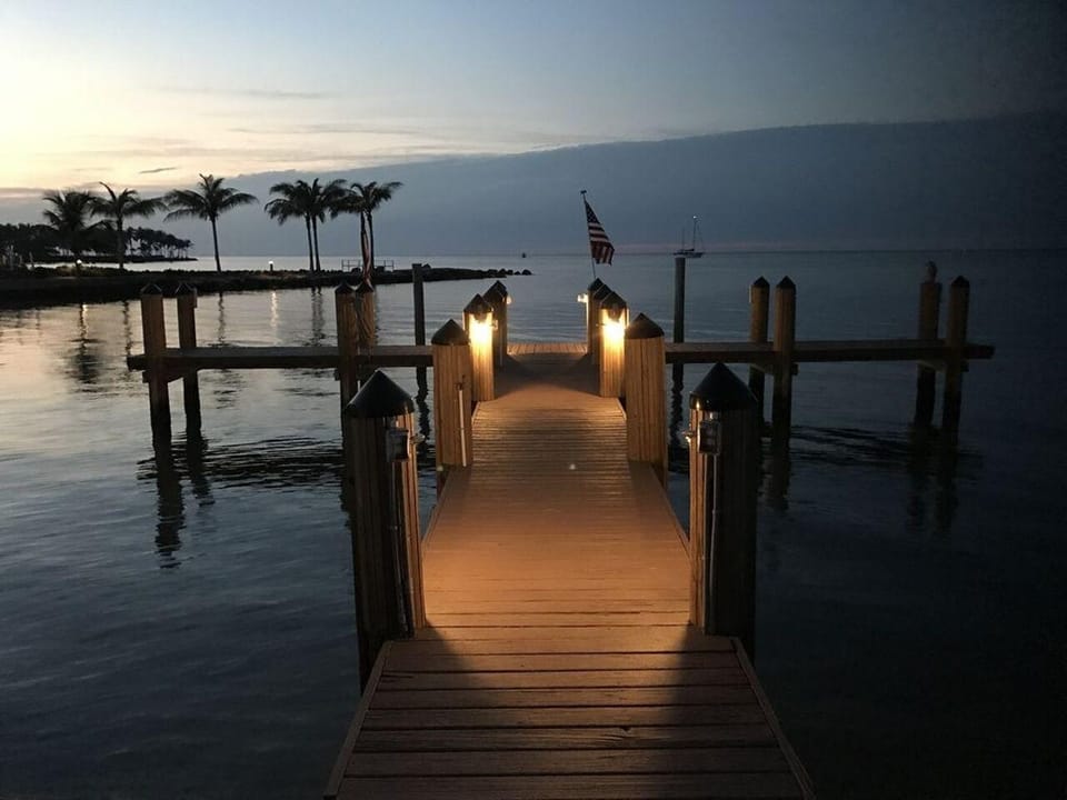 Dock At Sundown. Night Fishing Or Watch Star Sky