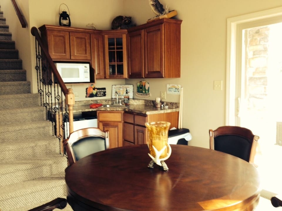 Lower level bar and gaming table.  Table converts to poker table and bumper pool