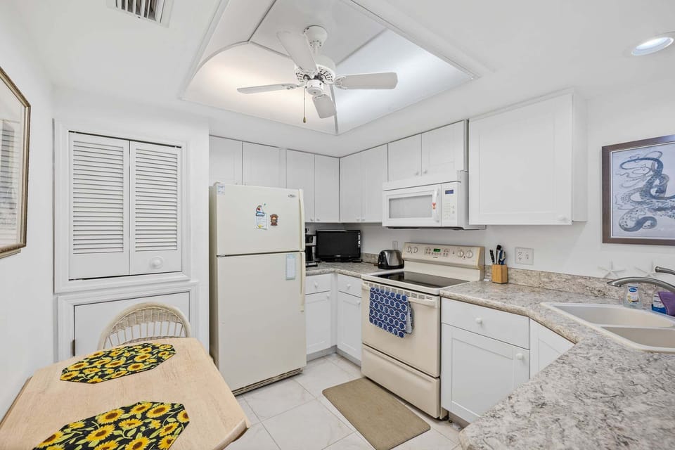 Well-appointed kitchen features ample cabinetry and plenty of prep space.