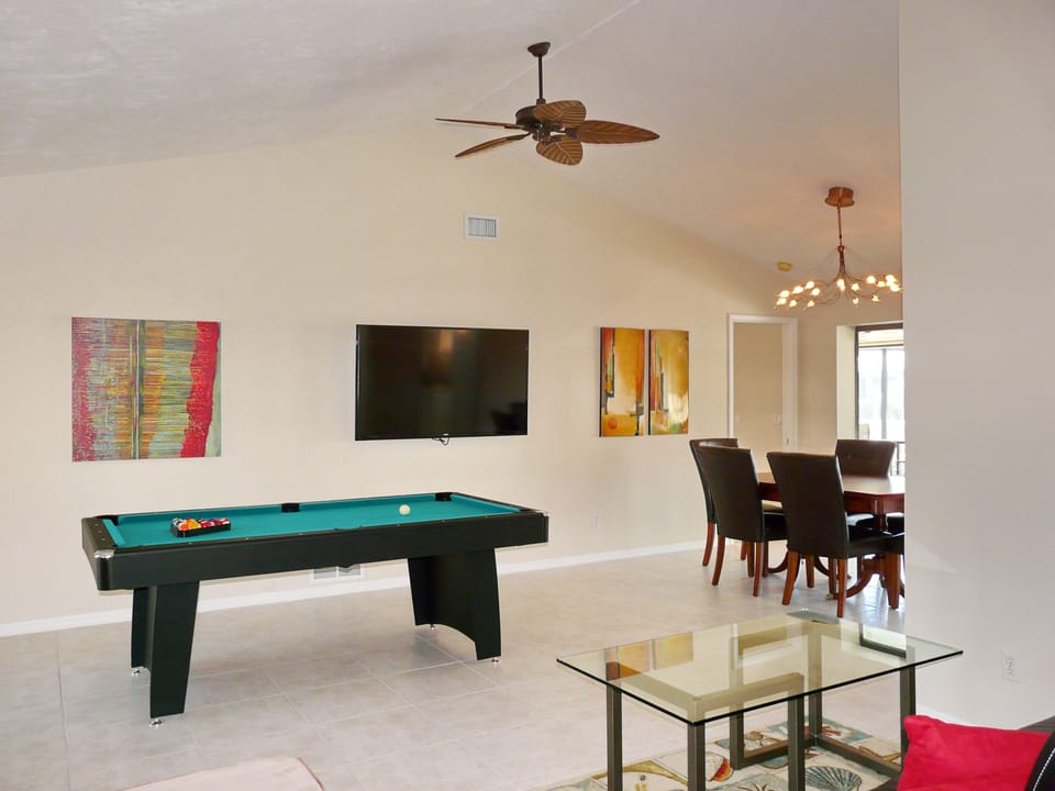 Full-size pool table complete with all accessories, 60" TV.