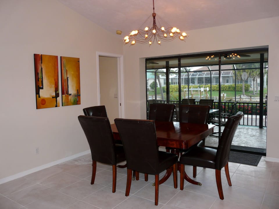 Dinning area with water view and sliding door access to lanai.