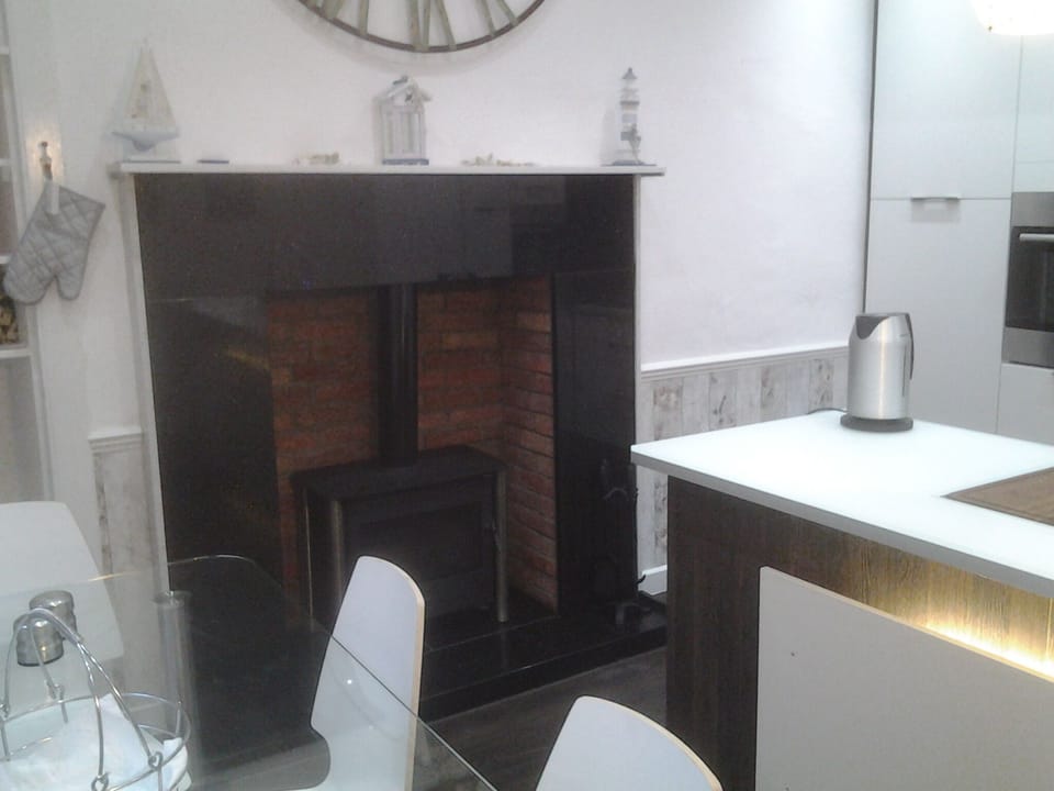 Kitchen (table, island and wood burning stove)
