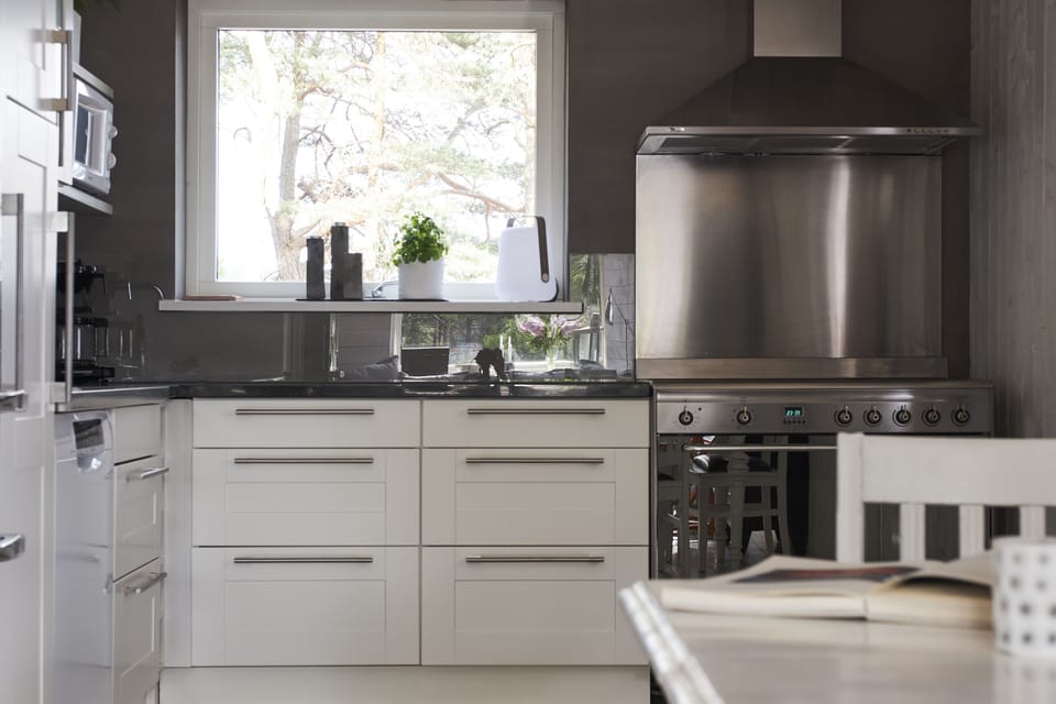 Modern and well equipped kitchen with big stove to cook wonderful meals