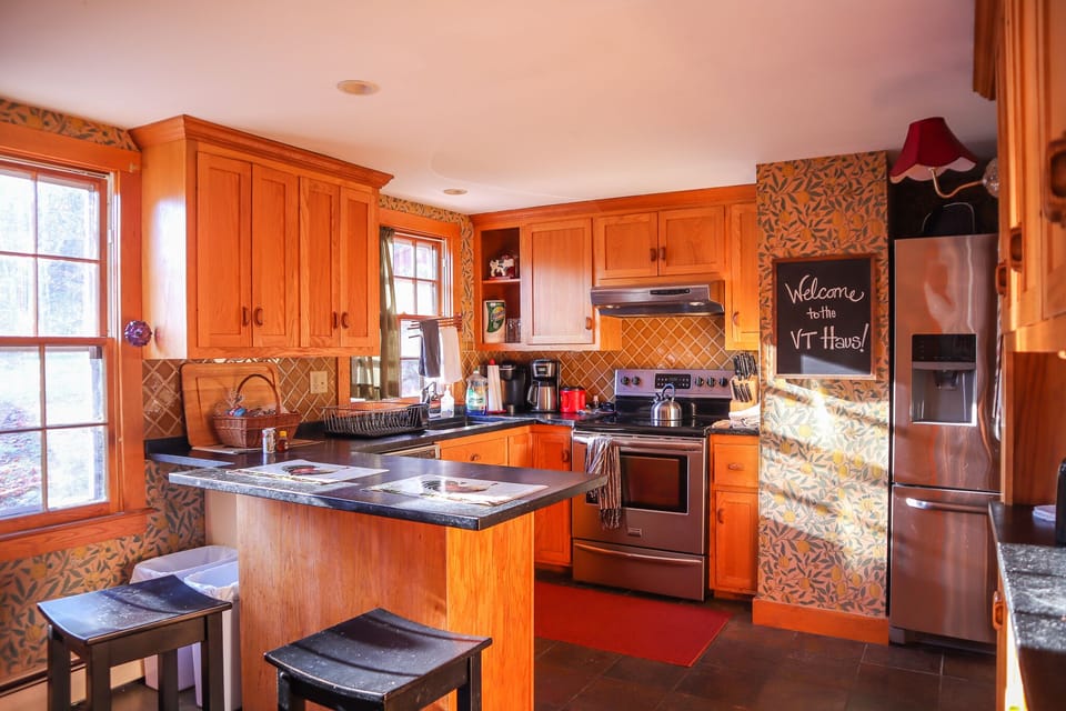Our kitchen is stocked with a coffee maker, pots, pans and cookware and utensils