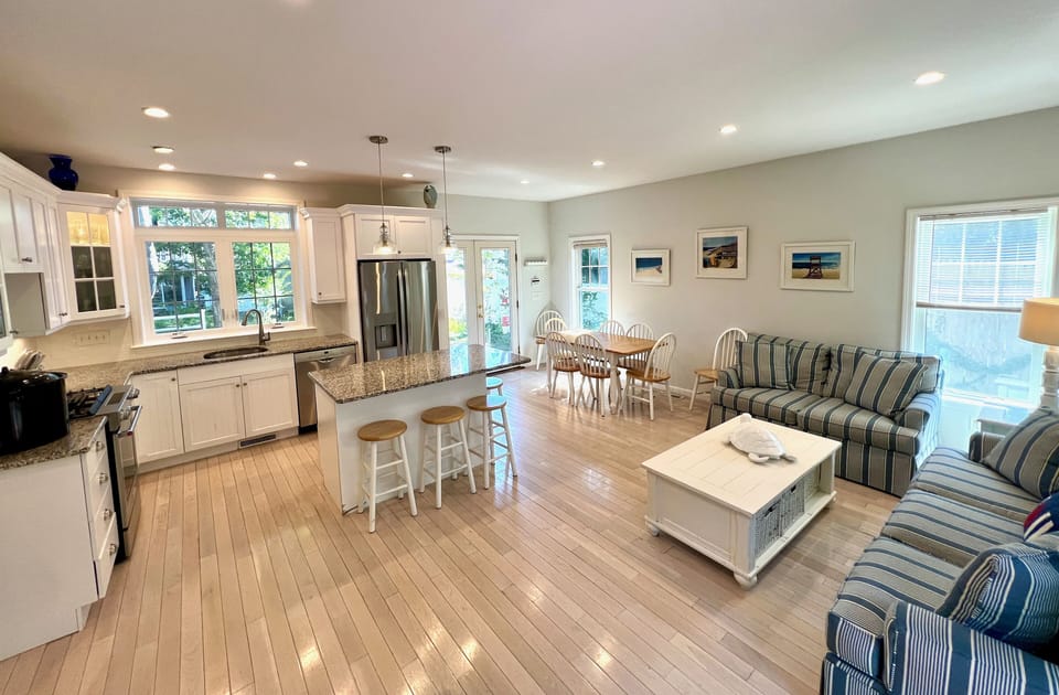 Open kitchen, dining, and living room area
