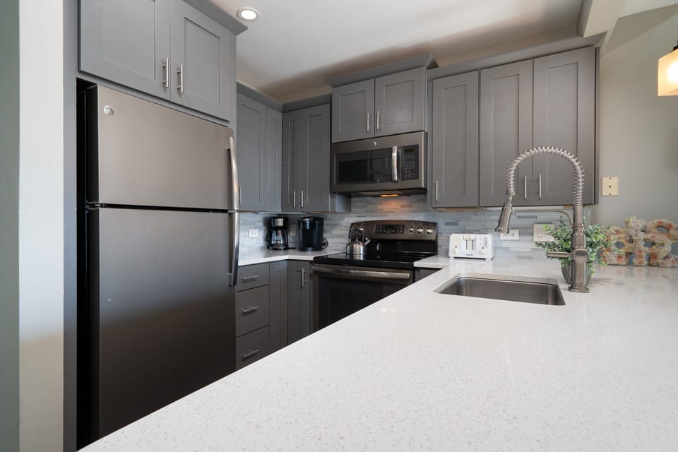 You will thoroughly enjoy cooking in this kitchen. Top line appliances, custom cabinets are highlights.
