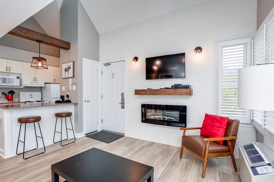 Kitchen island is beside the living room. 