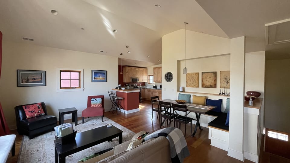Another view of living area looking into dining and kitchen spaces.
