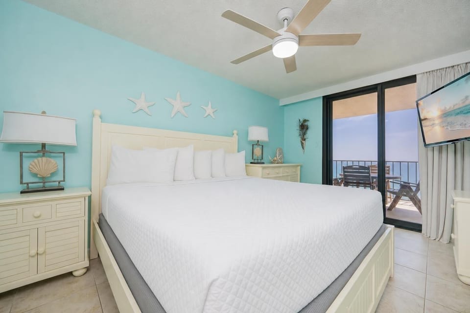 Your master suite with a king bed invites you to watch the sunset from the balcony
