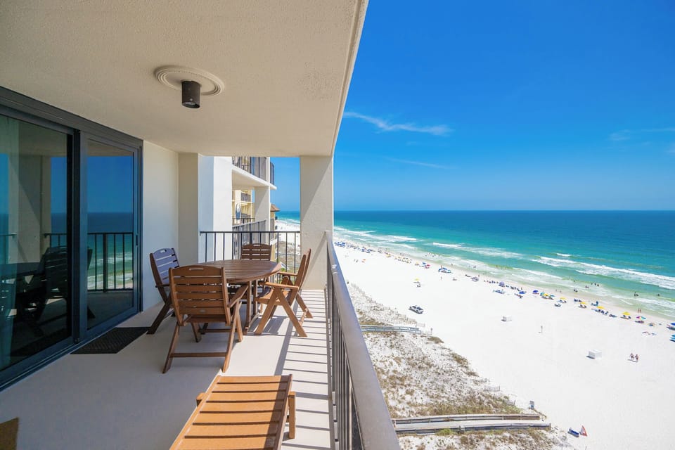 Warm gulf breezes surround your balcony as you relax watching waves roll onto the white sand shore