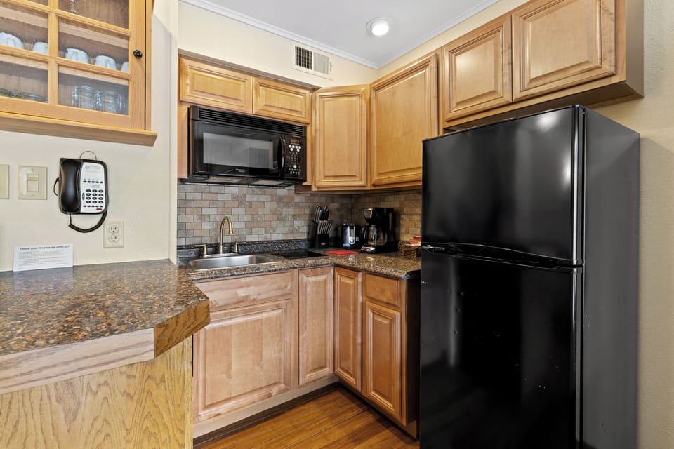 Suite, 1 Bedroom | Private kitchen | Fridge, microwave, stovetop, dishwasher