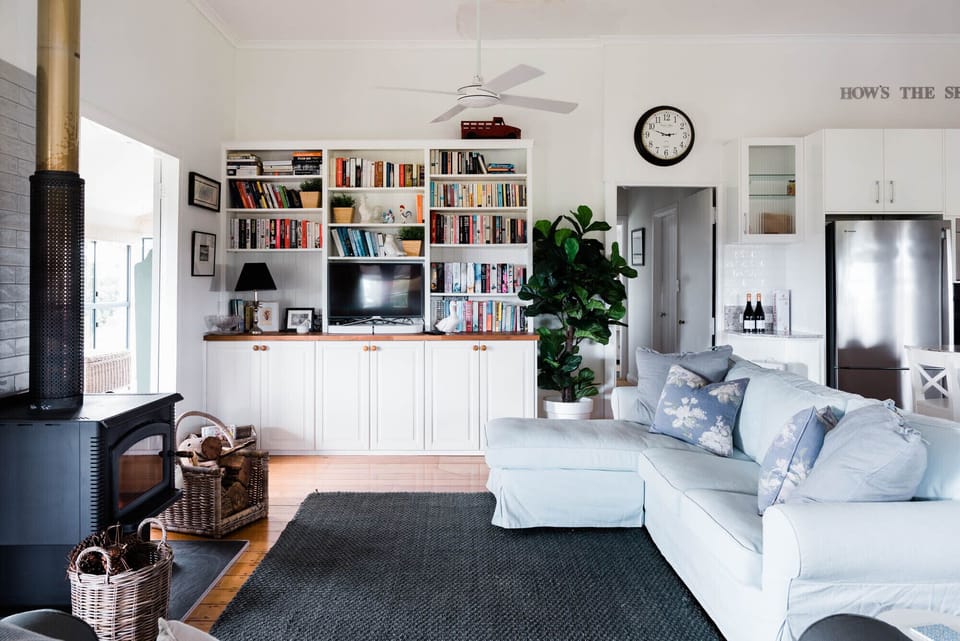 Big comfy couches and fully stocked family library in the cottage