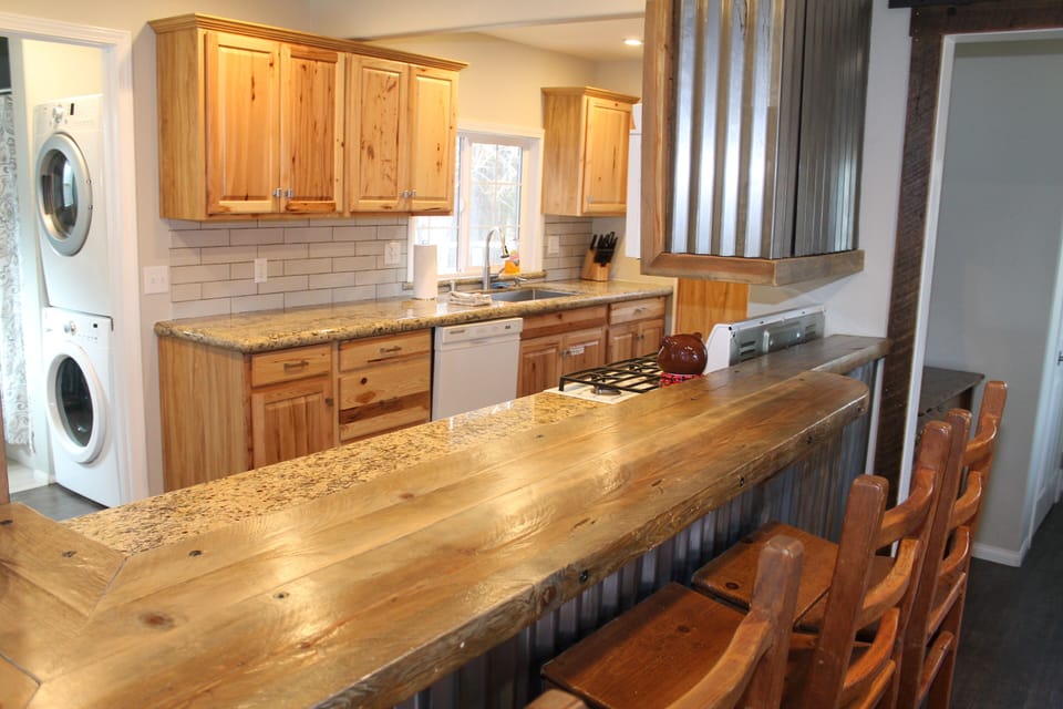 Kitchen with bar top counter that seats 3